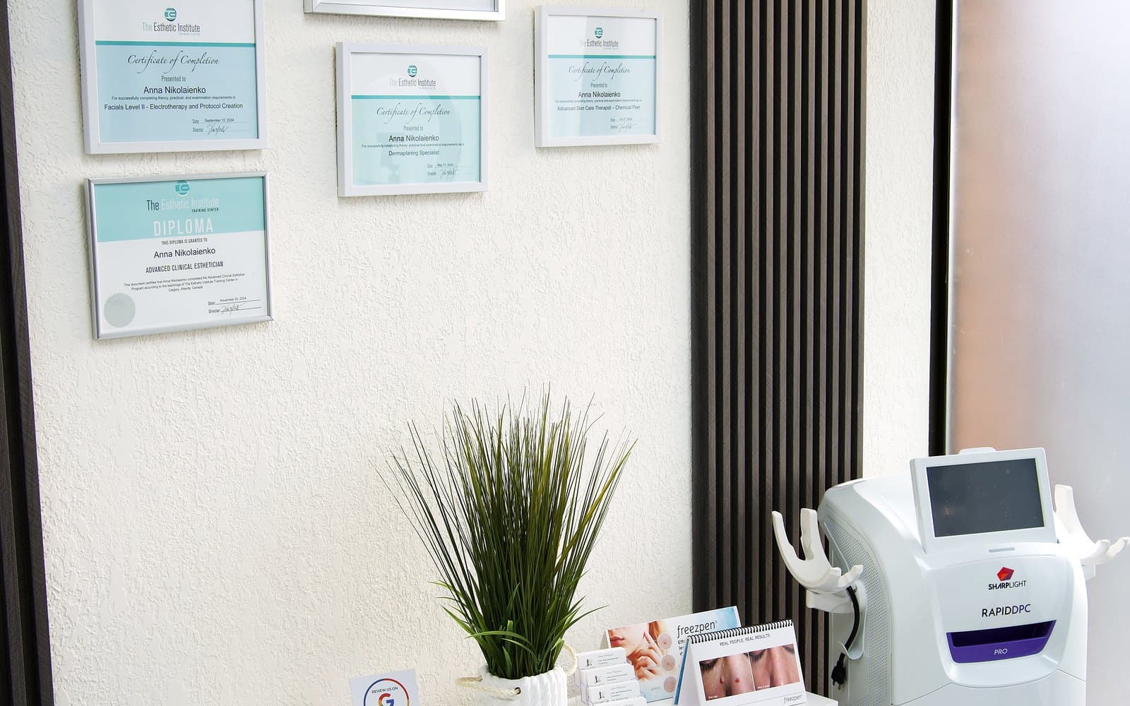 Treatment room with laser equipment and certification on display